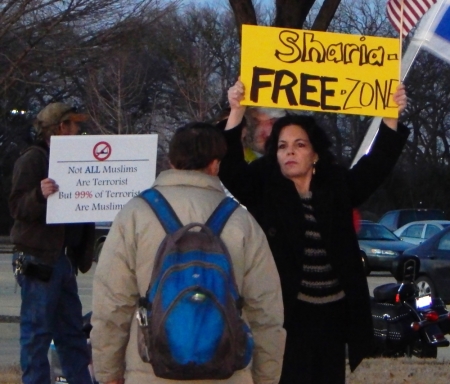 Protesters rally outside the 'Stand with the prophet against hate and terror' event sponsored by Sound Vision Foundation to 'challenge growing Islamophobia in American society,' at the Garland Independent School District's Curtis Culwell Center in Garland, Texas, January 17, 2015.