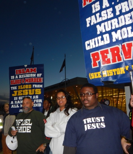 Ruben Israel (L), a member of Bible Believers, is joined by hundreds of protesters at a rally outside the 'Stand with the prophet against hate and terror' event sponsored by Sound Vision Foundation to 'challenge growing Islamophobia in American society,' at the Garland Independent School District's Curtis Culwell Center in Garland, Texas, January 17, 2015.