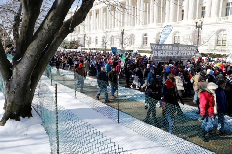 Pro-life activists participate in the annual March for Life in Washington, January 22, 2014. Pope Francis used Twitter to back the annual anti-abortion rally, which was expected to draw hundreds of thousands of activists to Washington on Wednesday.