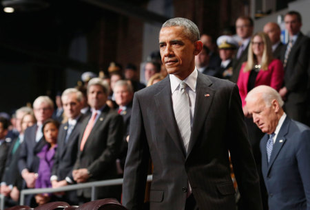 U.S. President Barack Obama and Vice President Joe Biden (R) arrive at the armed services farewell in honor of Defense Secretary Chuck Hagel at Joint Base Myer-Henderson Hall in Virginia, January 28, 2015.