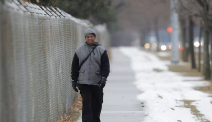 James Robertson, 56, walks to work.