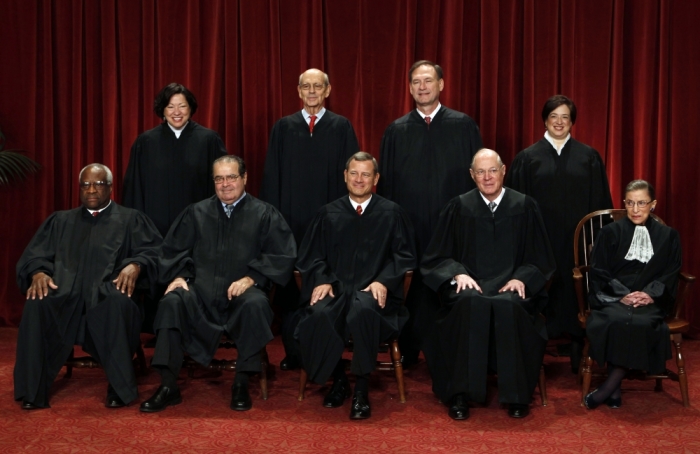 The justices of the U.S. Supreme Court gather for a group portrait in the East Conference Room at the Supreme Court Building in Washington, October 8, 2010. Seated from left to right in front row are: Associate Justice Clarence Thomas, Associate Justice Antonin Scalia, Chief Justice John G. Roberts, Associate Justice Anthony M. Kennedy, Associate Justice Ruth Bader Ginsburg. Standing from left to right in back row are: Associate Justice Sonia Sotomayor, Associate Justice Stephen Breyer, Associate Justice Samuel Alito Jr., and Associate Justice Elena Kagan.