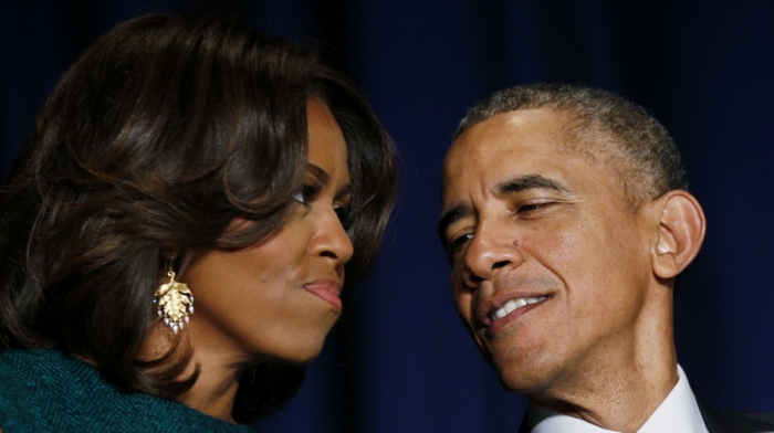 U.S. President Barack Obama and first lady Michelle Obama look toward one another during the National Prayer Breakfast in Washington, February 5, 2015.