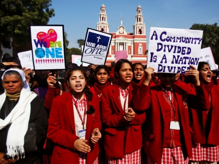 Demonstrators shout slogans as they hold placards during a protest outside a church in New Delhi, India, February 5, 2015. Hundreds of Christian protesters clashed with police in India's capital on Thursday as they tried to press demands for better government protection amid concern about rising intolerance after a series of attacks on churches.