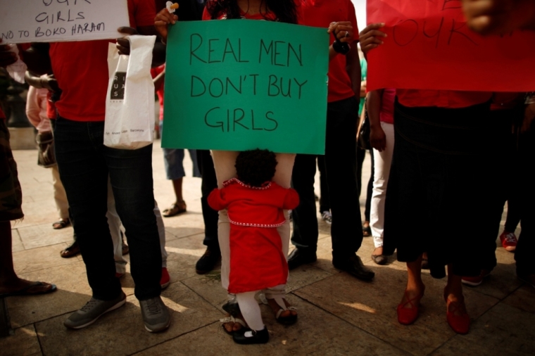 Nigerians take part in a protest, called by Malaga's Nigerian women Association, for the release of the abducted secondary school girls in the remote village of Chibok in Nigeria, at La Merced square in Malaga, southern Spain May 13, 2014. The leader of the Nigerian Islamist rebel group Boko Haram has offered to release more than 200 schoolgirls abducted by his fighters last month in exchange for its members being held in detention, according to a video posted on YouTube on Monday.