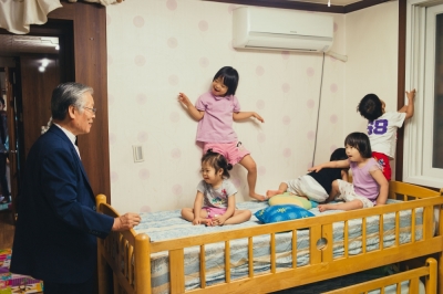 Scene from the film, 'The Drop Box.' South Korean Pastor Lee Jong-rak with some of the children he adopted.