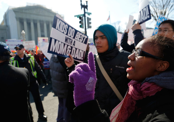 Protesters against gay marriage shout slogans in front of the U.S. Supreme Court in Washington, March 26, 2013. Two members of the U.S. Supreme Court, both viewed as potential swing votes on the right of gay couples to marry, raised doubts about California's gay marriage ban on Tuesday as they questioned a lawyer defending the ban.