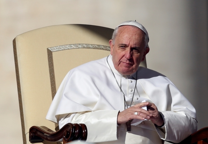 Pope Francis attends during the general audience in St. Peter's Square at the Vatican, Rome, Italy, February 11, 2015.