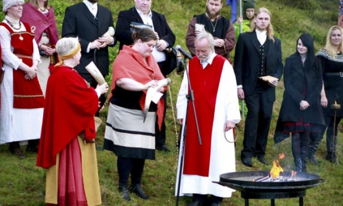 High priest Hilmar Orn Hilmarsson and fellow members of the Asatru Association attend a ceremony at the Pingvellir National Park near Reykjavik in this undated photo.