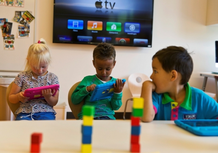 Students look at their iPads at the Steve Jobs school in Sneek, August 21, 2013. The Steve Jobs schools in the Netherlands are founded by the Education For A New Time organization, which provides the children with iPads to help them learn with a more interactive experience.