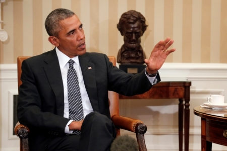 U.S. President Barack Obama talks to reporters after meeting with newly sworn-in Defense Secretary Ash Carter (not pictured) in the Oval Office at the White House in Washington, February 17, 2015.