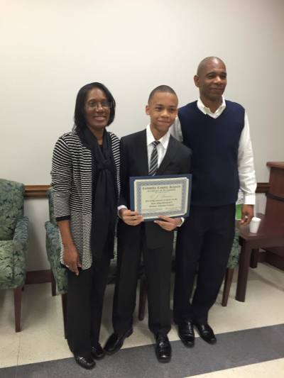 CJ Pearson (c) with his parents.