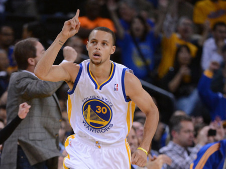 Stephen Curry celebrates a made three-point shot.