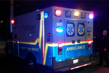 A Ferguson police officer is transported by ambulance to Barnes-Jewish Hospital after being shot during protests in Ferguson, Missouri, March 12, 2015.