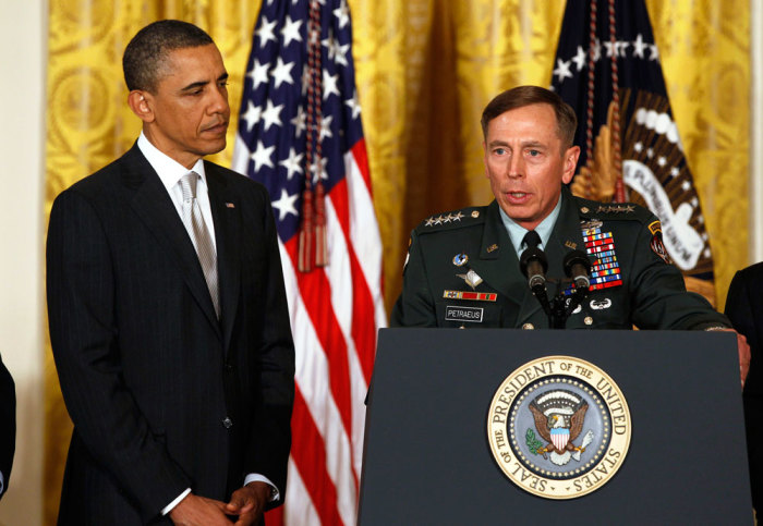 U.S. Army Gen. David Petraeus talks next to U.S. President Barack Obama at an event in the East Room of the White House in this April 28, 2011 file photo during Obama's announcement that then CIA Director Leon Panetta would be nominated as Secretary of Defense. Former CIA Director Petraeus will testify November 16, 2012 on Capitol Hill about the recent attack on the U.S. diplomatic mission in Benghazi, Libya, but is also expected to be asked about his resignation last week over an extramarital affair.