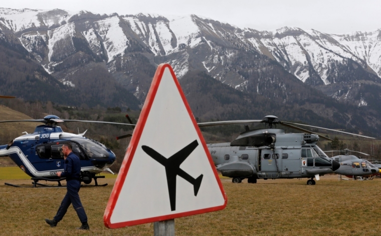 Rescue helicopters from the French Gendarmerie and the Air Force are seen in front of the French Alps during a rescue operation next to the crash site of an Airbus A320, near Seyne-les-Alpes, March 24, 2015. An Airbus plane operated by Lufthansa's Germanwings budget airline, en route from Barcelona to Duesseldorf, crashed in a remote snowy area of the French Alps on Tuesday and all 150 on board were feared dead.