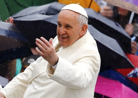 Pope Francis waves as he arrives to lead the weekly audience in Saint Peter's square at the Vatican, Rome, Italy, March 25, 2015.