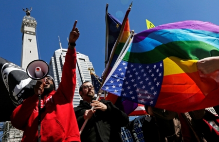 Organizers fire up a crowd of demonstrators gathered to protest a controversial religious freedom bill recently signed by Governor Mike Pence, in Indianapolis, Indiana, March 28, 2015. More than 2,000 Hoosiers gathered at the Indiana State Capital Saturday to protest Indiana's newly signed Religious Freedom Restoration Act saying it would promote discrimination against individuals based on sexual orientation.