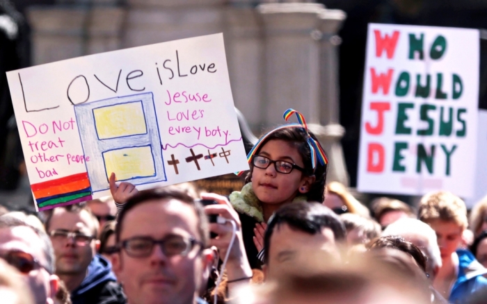 Demonstrators gather at Monument Circle to protest a controversial religious freedom bill recently signed by Governor Mike Pence during a rally in Indianapolis, Indiana, March 28, 2015. More than 2,000 people gathered at the Indiana State Capital Saturday to protest Indiana?s newly signed Religious Freedom Restoration Act saying it would promote discrimination against individuals based on sexual orientation.