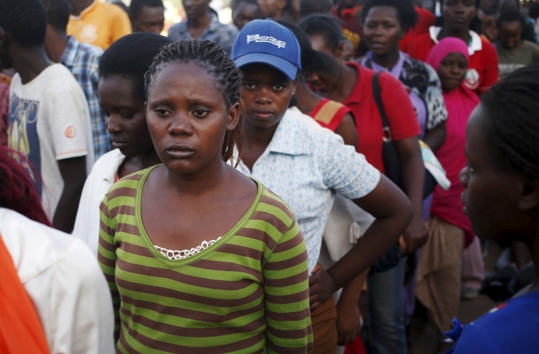 Garissa University students wait at a temporary shelter as they wait for relocation after Thursday's attack by gunmen in their campus, in Garissa April 3, 2015. The death toll in an assault by Somali militants on a Kenyan university is likely to climb above 147, a government source and media said on Friday, as anger grew among local residents over what they say was a government failure to prevent bloodshed. Strapped with explosives, masked al Shabaab gunmen stormed the Garissa University College campus, some 200 km (120 miles) from the Somali border, in a pre-dawn rampage on Thursday.