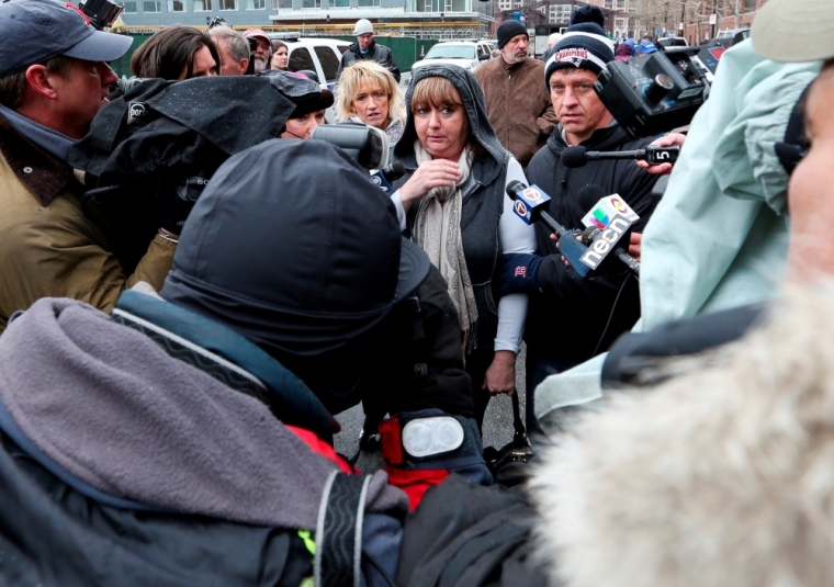 Liz Norden (C) and Mike Ward (R) leave the courthouse after a jury found Boston Marathon bombing suspect Dzhokhar Tsarnaev guilty in Boston, Massachusetts, April 8, 2015. Liz Norden's two sons, JP and Paul Norden, both lost limbs in the bombing. Tsarnaev was found guilty on Wednesday of the 2013 Boston Marathon bombing that killed three people and injured 264 others, and the jury will now decide whether to sentence him to death.