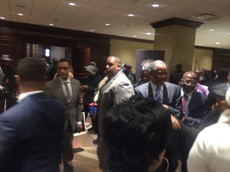 Dr. Ben Carson (R) tries to escape the throng after delivering a rousing speech at the National Action Network's convention in New York City on Wednesday, April 8, 2015.