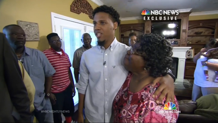 Walter Scott's mother Judy Scott (r) hugs her 'ram in the bush' witness, Feidin Santana, 23.