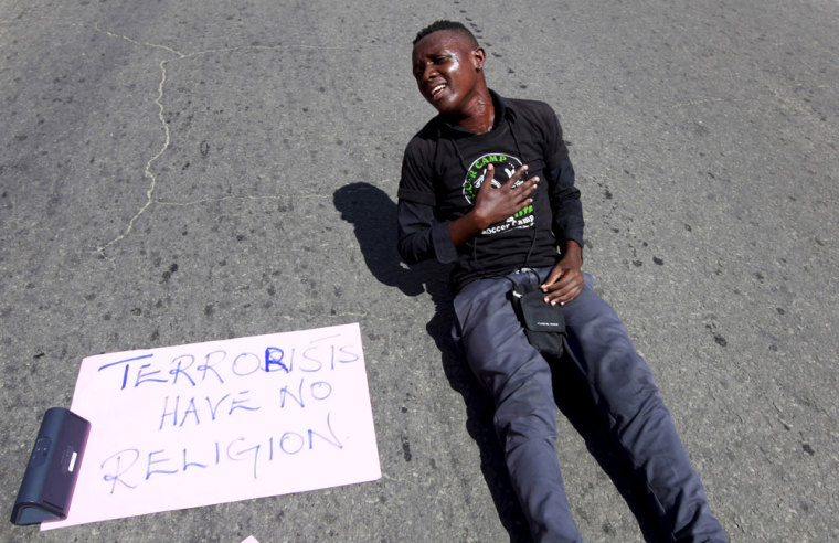 A university student reacts during a demonstration condemning the gunmen attack at Garissa University campus in the Kenyan coastal port city of Mombasa April 8, 2015. Kenya needs more help from its U.S. and European allies with intelligence and security measures to help prevent further massacres by Somali militants, Foreign Minister Amina Mohamed told Reuters. Last week's killing of 148 people at a university has piled pressure on President Uhuru Kenyatta to stop frequent gun and grenade assaults staged on Kenyan soil by the al Shabaab group, which is aligned to al Qaeda.