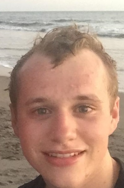 Josiah Duggar on the beach with his family.