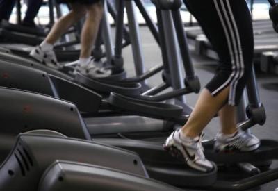 Clients work out on machines at the Bally Total Fitness facility in Arvada, Colorado