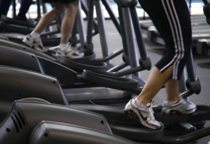 Clients work out on machines in Arvada, Colorado.