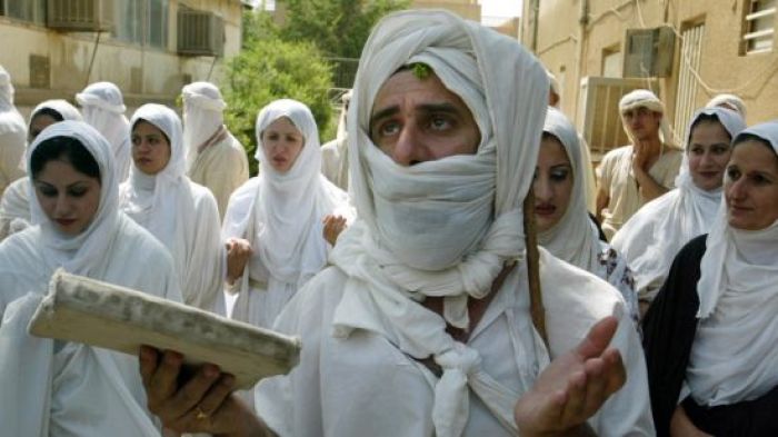 An Iraqi Mandean priest conducts a wedding ceremony for five couples in the ancient Aramaic language on the Tigris river in Baghdad in this undated file photo.