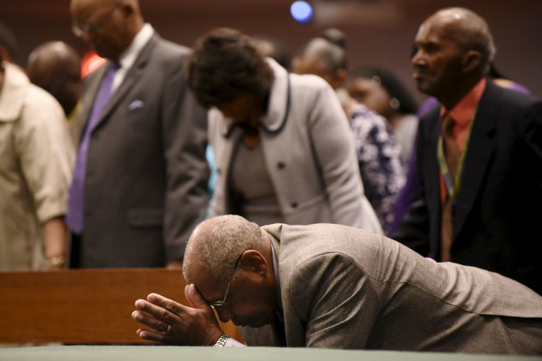 Members of the community pray during Sunday morning worship at New Shiloh Baptist Church, where Freddie Gray's April 27 funeral service was held in Baltimore, May 3, 2015. The city of Baltimore was on Sunday to observe a day of prayer two weeks after Gray, a 25-year-old black man, died of injuries suffered in police custody in a case that has led to criminal charges against six officers.