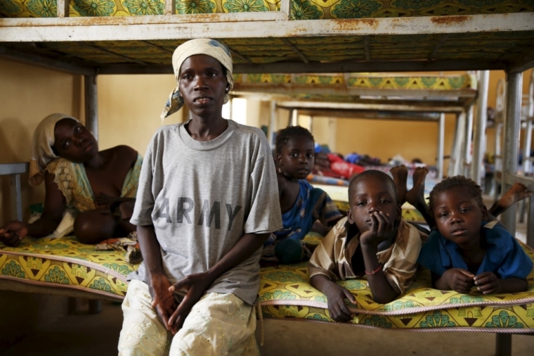 Cicilia Abel, from the local government of Michika, rests with her children at the Malkohi camp for the Internally Displaced People, after being rescued from Boko Haram in Sambisa forest, in Yola, Adamawa State, Nigeria, May 3, 2015.