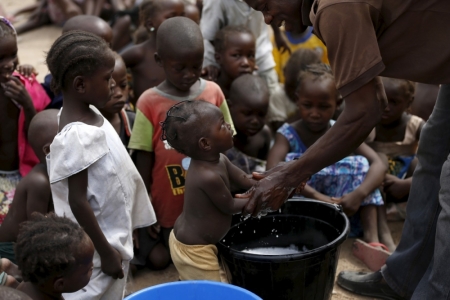 Children rescued from Boko Haram in Sambisa forest get their hands washed at the Internally Displaced People's camp in Yola, Adamawa State, Nigeria, on May 3, 2015. Hundreds of traumatised Nigerian women and children rescued from Boko Haram Islamists have been released into the care of authorities at a refugee camp in the eastern town of Yola, an army spokesman said.