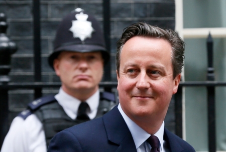 Britain's Prime Minister David Cameron leaves Number 10 Downing Street to meet with Queen Elizabeth at Buckingham Palace in London, Britain, May 8, 2015.