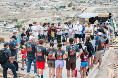 Volunteers gather for a 'Homes for Hope' project.