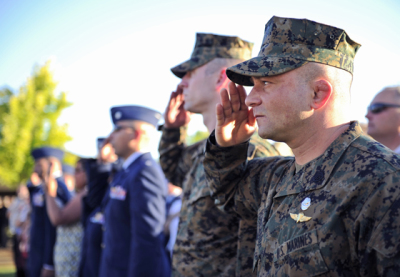 Chad Robichaux saluting in his Marines uniform