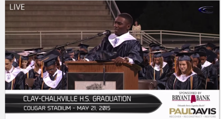 Christian Crawford prays for a women facing a medical emergency at the Clay-Clarkville High School graduation in Alabama, May 2015.