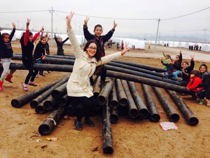 Humanitarian activist Delal Sindy playing with displaced Iraq children at a refugee camp in northern Iraq.