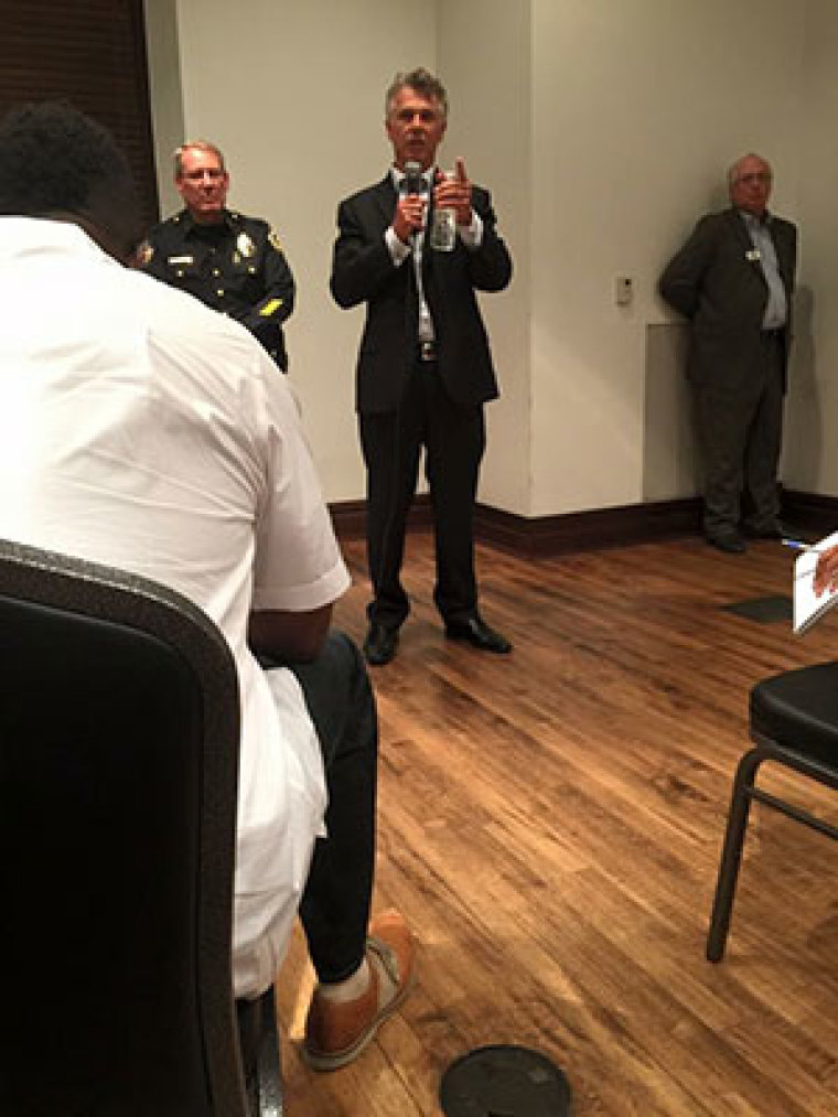 Local pastors in McKinney, Texas, meet with Mayor Brian Loughmiller and Police Chief Greg Conley Monday night, June 8, 2015, to discuss and pray over an altercation between police, local residents and teenagers at a private pool for residents in the Craig Ranch neighborhood of McKinney, located north of Dallas.