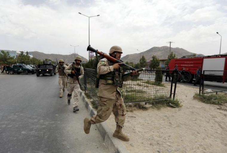 Afghan security forces arrive at the site of an attack near the Afghan parliament in Kabul, Afghanistan June 22, 2015.