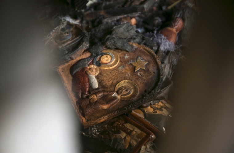 A religious icon is seen on the floor of the Church of Loaves and Fishes on the shores of the Sea of Galilee in northern Israel, June 18, 2015. Fire gutted part of the Church on Thursday and investigators suspected arson as a possible cause, a police spokesman said.The church, which Christians believe is where Jesus performed the Miracle of the Multiplication of the Loaves and the Fishes, lies on the shores of the Sea of Galilee and is a traditional site of pilgrimage in the Holy Land.