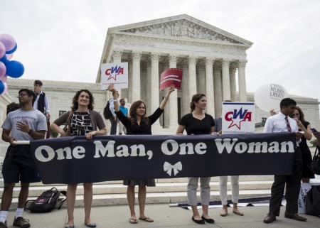 Supporters of traditional marriage between a man and a woman rally in front of the Supreme Court in Washington, June 26, 2015. The Supreme Court ruled on Friday that the U.S. Constitution provides same-sex couples the right to marry in a historic triumph for the American gay rights movement.