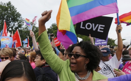 Gay rights supporters celebrate after the U.S. Supreme Court ruled that the U.S. Constitution provides same-sex couples the right to marry, outside the Supreme Court building in Washington, June 26, 2015. The court ruled 5-4 that the Constitution's guarantees of due process and equal protection under the law mean that states cannot ban same-sex marriages.