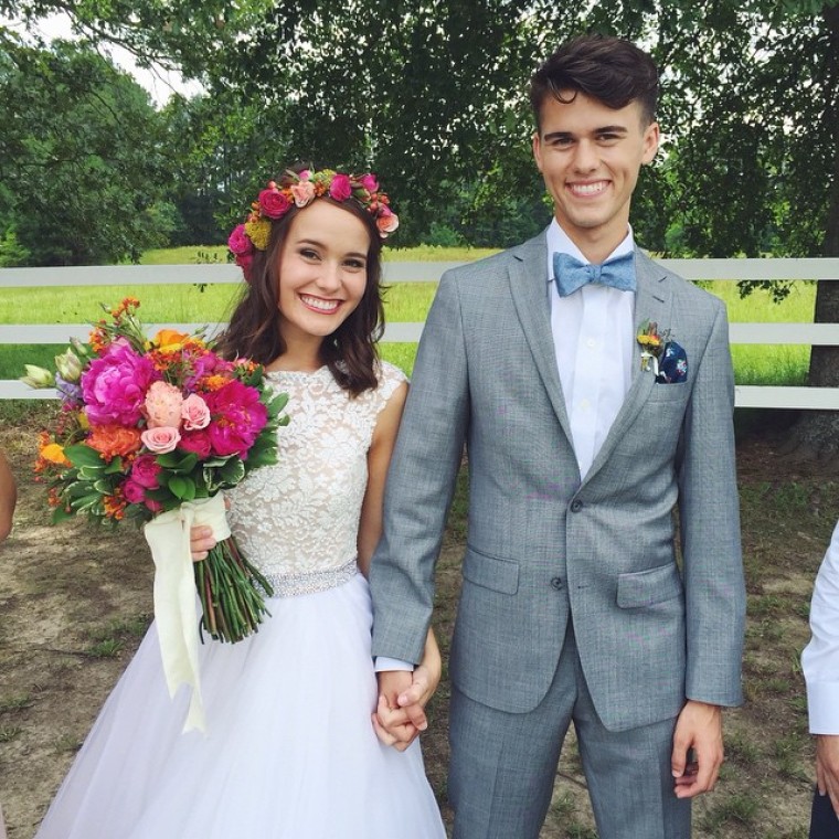 “Duck Dynasty” star John Luke Robertson married his fiancee, Mary Kate McEacharn, in a country style wedding on June 27, 2015.