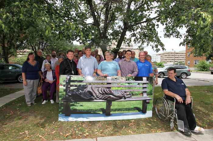 A group of people seeking to raise funds to install a 'Homeless Jesus' statue in Indianapolis, Indiana. From Left: Rev. Andrew Scanlan-Holmes of Roberts Park United Methodist Church, Steve Kerr of Wheeler Mission, Mary Sue McAlister of Soup's On, Chris Purnell of Neighborhood Christian Legal Clinic, and Erich Howard of Outreach Inc.