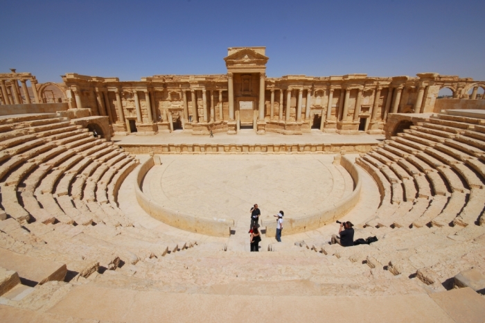 Tourists take pictures at the ancient Palmyra theater in the historical city of Palmyra, Syria, April 18, 2008. Islamic State fighters in Syria have entered the ancient ruins of Palmyra after taking complete control of the central city, but there are no reports so far of any destruction of antiquities, a group monitoring the war said on May 21, 2015.