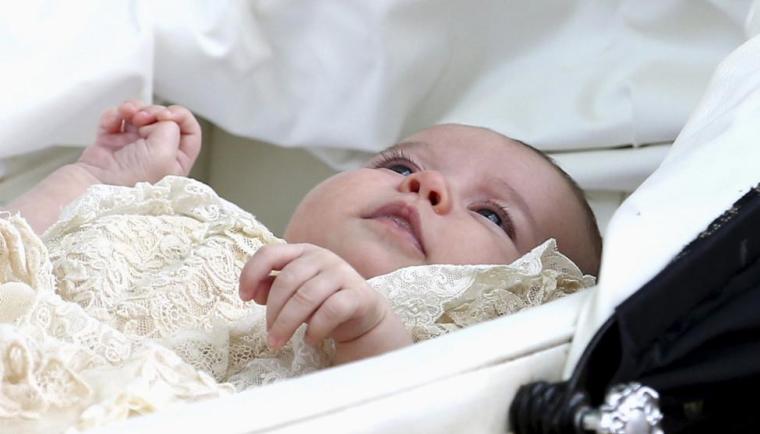 Princess Charlotte is seen inside a pram as she leaves the Church of St. Mary Magdalene in Sandringham, Britain after her christening July 5, 2015.