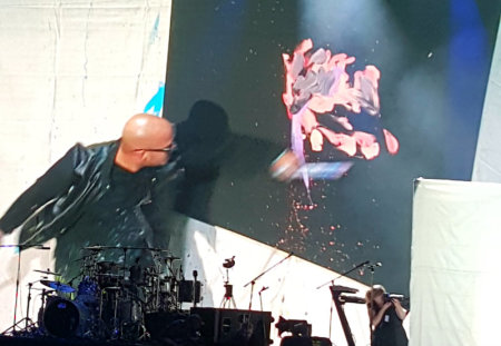 Performance painter David Garibaldi paints live before an audience gathered Tuesday, July 7, 2015, at Radio City Music Hall in New York City for The Luis Palau Association NYCityFest.